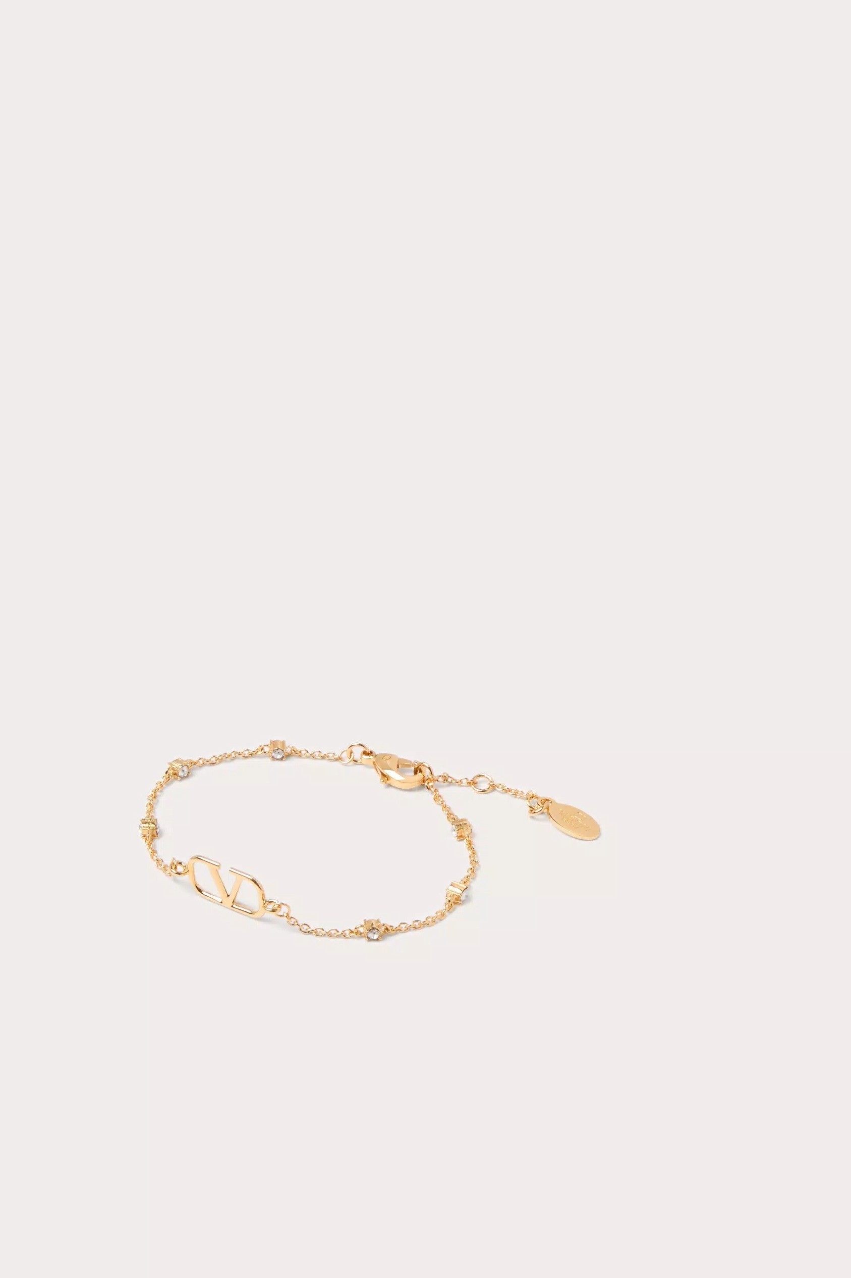 VLOGO SIGNATURE METAL AND SWAROVSKI® CRYSTAL BRACELET - Gold